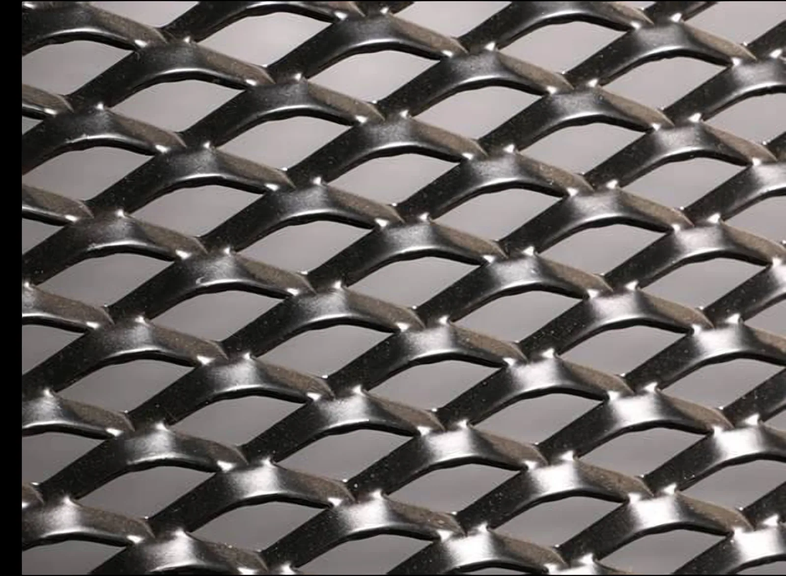 Close-up of expanded metal mesh with diamond openings