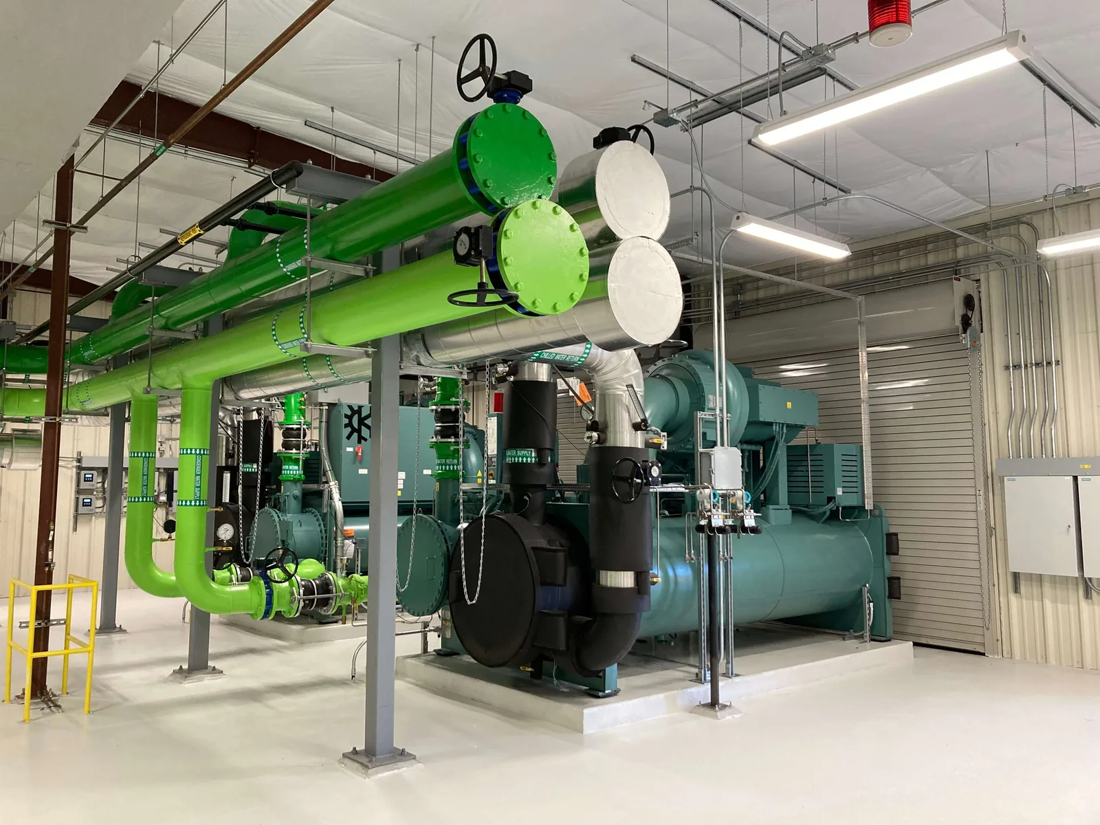 Chiller and chilled-water piping installation in a plant room