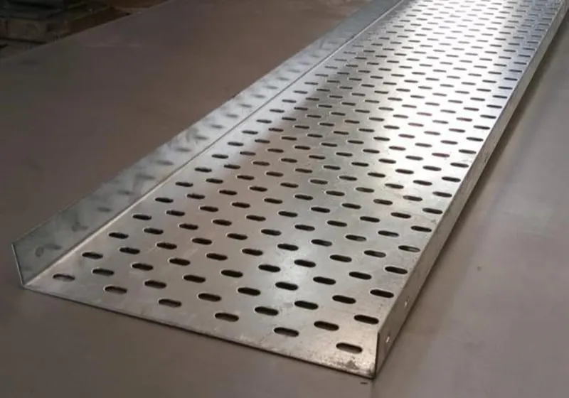 Close-up of a perforated cable tray base with slotted holes